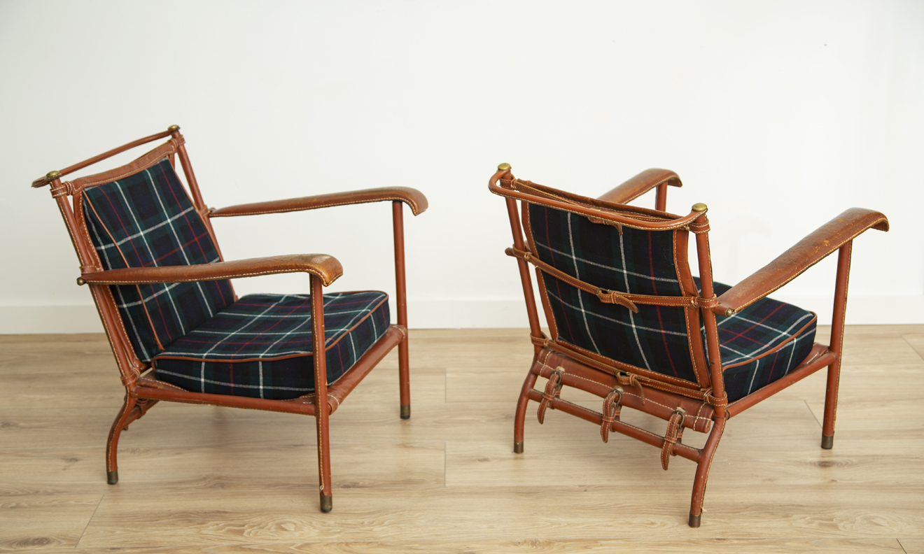 Rare Pair of Lounge Chairs by Jacques Adnet.